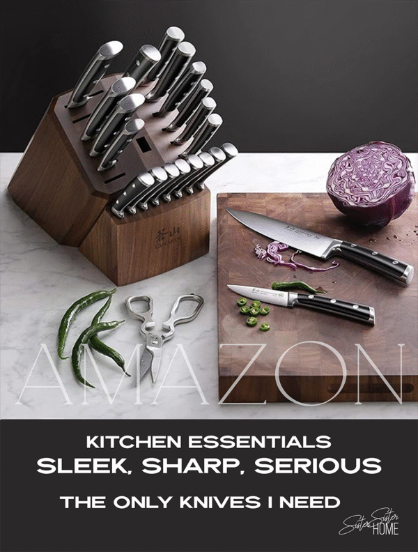 Cangshan stainless steel knife block set on marble counter with cutting board, jalapeños, and cabbage, styled for a sleek modern kitchen.