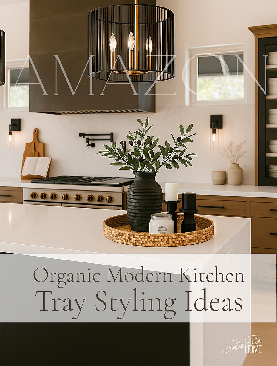 Elevate your kitchen island styling with this Organic Modern tray setup featuring a woven rattan tray, black ceramic vase with faux olive branches, sculptural black candle holders, a white Capri Blue Volcano candle, and ivory pillar candles. This neutral yet striking arrangement adds warmth, texture, and modern sophistication to any kitchen decor.