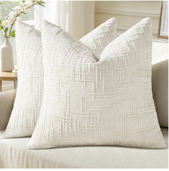 Cream chenille euro throw pillow covers with textured pattern styled on a neutral sofa in an organic modern living room.