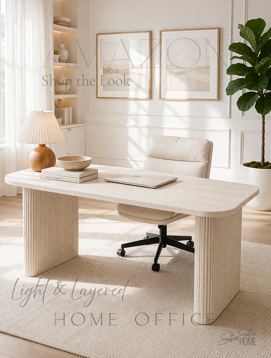 Light and layered organic modern home office with cream desk, neutral chair, flatweave rug, and warm wood accents