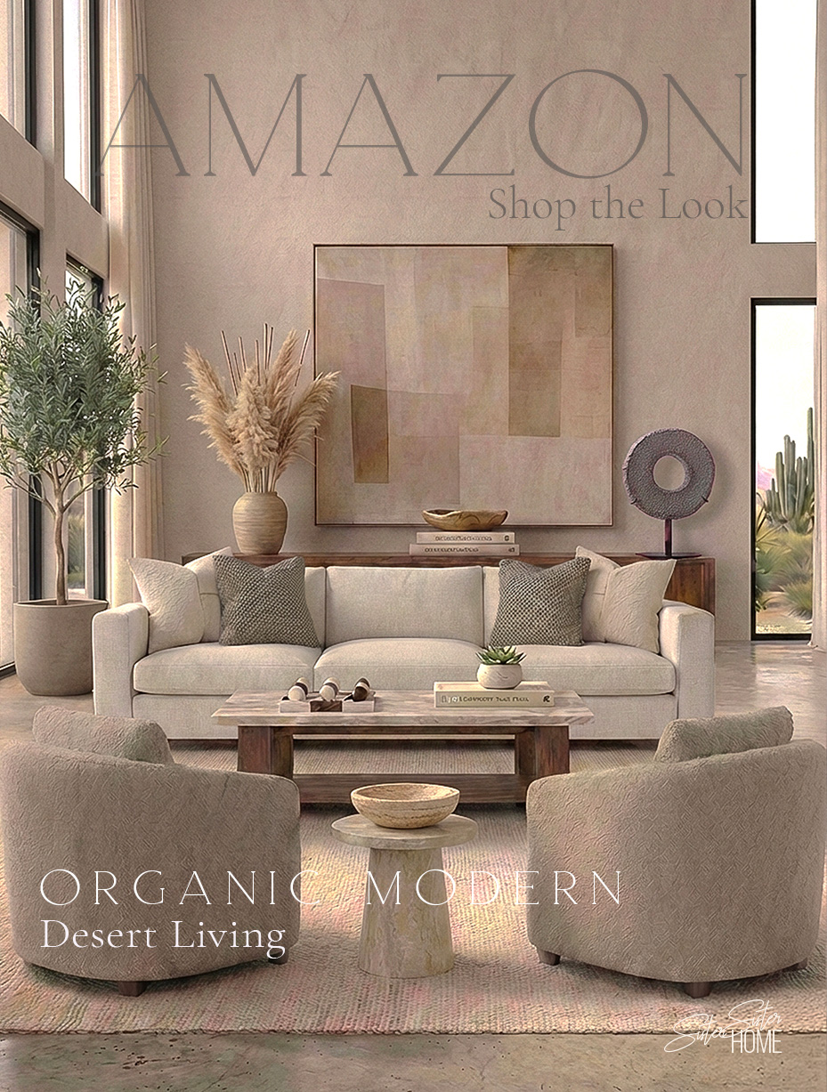 Organic modern desert living room with neutral sofa, boucle accent chairs, wood coffee table, pampas grass decor and large abstract wall art.