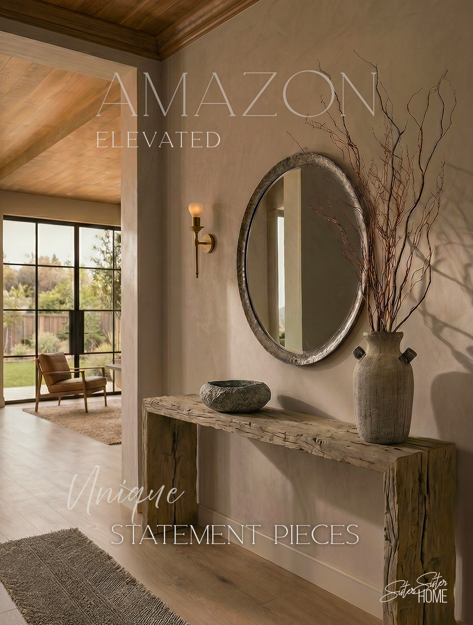 Organic modern console styling with reclaimed wood table, round metal mirror, textured vase, and natural accents in a warm neutral space