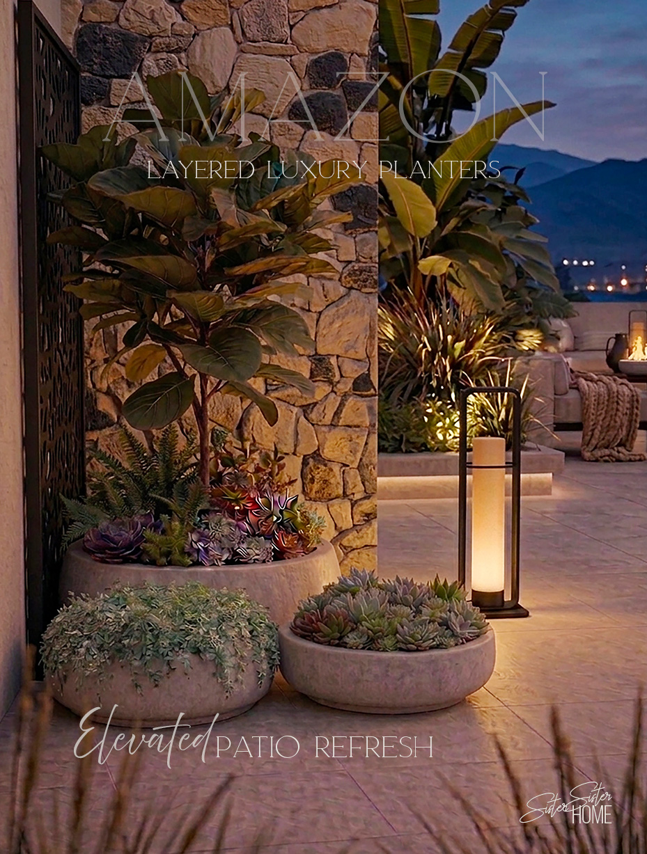 Layered outdoor concrete planters styled on a modern patio with warm lighting, featuring lush greenery and succulents in low-profile round pots.