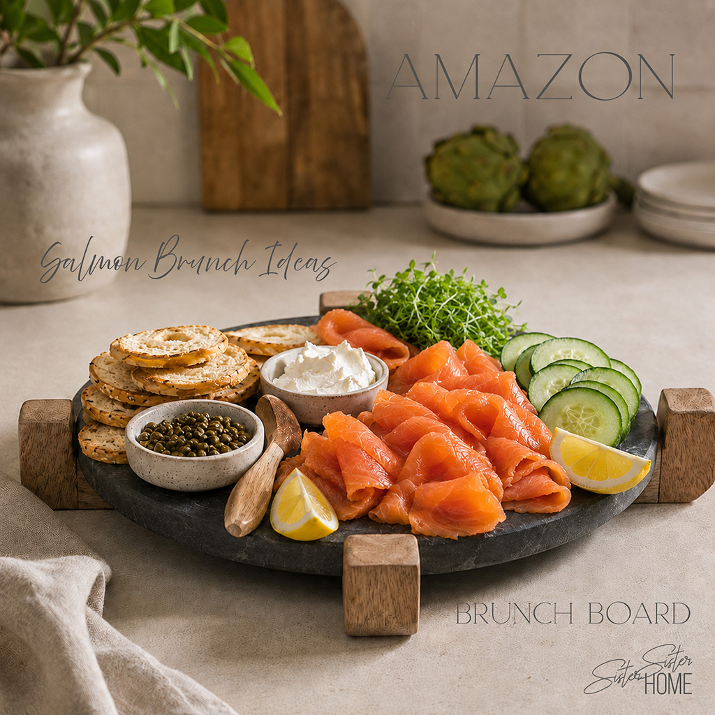 Smoked salmon brunch board styled on a black marble serving tray with bagels, cream cheese, capers, cucumbers, lemon, and charcuterie accessories.