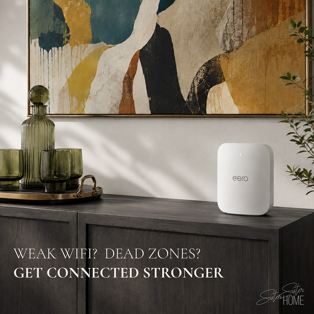 Amazon eero Pro 7 Wi-Fi 7 router styled on a dark modern cabinet with green glassware and abstract wall art
