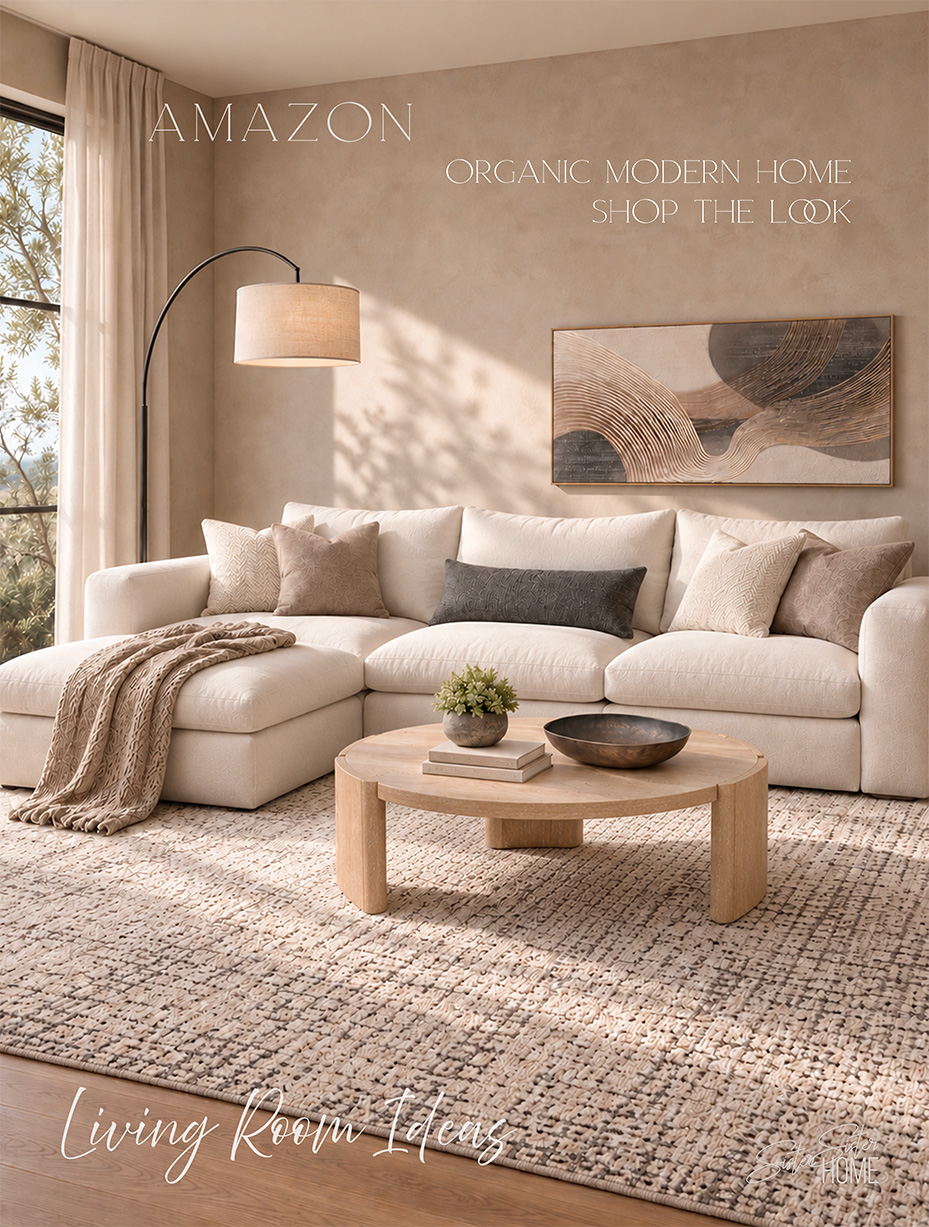 Organic modern living room with a beige sectional, round oak coffee table, textured rug, abstract wall art and black arc lamp.